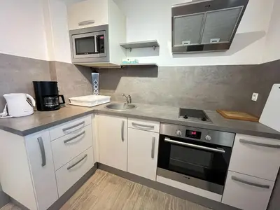 Cuisine ou kitchenette dans l'établissement Studio spacieux, proche mer et thalasso, parking privé