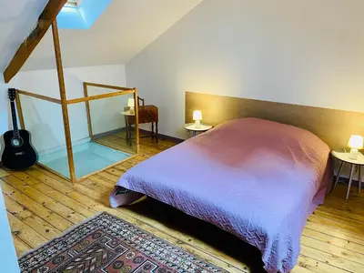 Un ou plusieurs lits dans un hébergement de l'établissement La maison du Cordonnier