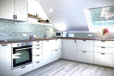 Cuisine ou kitchenette dans l'établissement La Balise-Appart dans un manoir-Vue mer et jardin