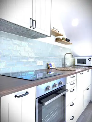 Cuisine ou kitchenette dans l'établissement La Balise-Appart dans un manoir-Vue mer et jardin