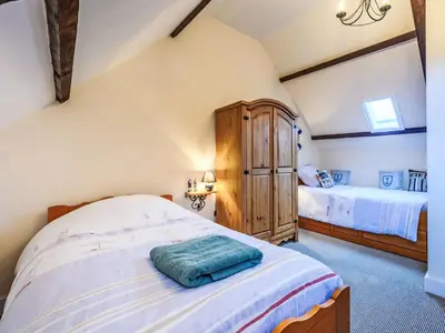 Un ou plusieurs lits dans un hébergement de l'établissement Holiday Home Maison de Langonnet by Interhome
