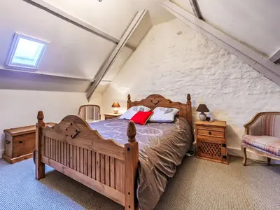 Un ou plusieurs lits dans un hébergement de l'établissement Holiday Home Maison de Langonnet by Interhome