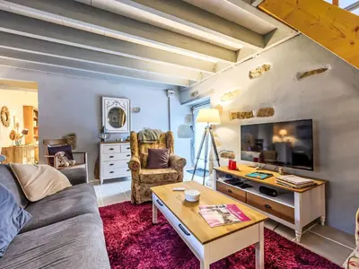 Coin salon dans l'établissement Holiday Home Maison de Langonnet by Interhome