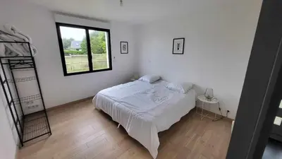 Un ou plusieurs lits dans un hébergement de l'établissement Les Hauts de Trégana 4 chambres