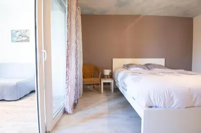 Un ou plusieurs lits dans un hébergement de l'établissement Le Petit Moulin I Plage et terrasse