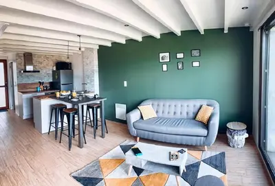 Coin salon dans l'établissement Charmant appartement T3 avec terrasse en rez de jardin sur le Golf e L'Odet