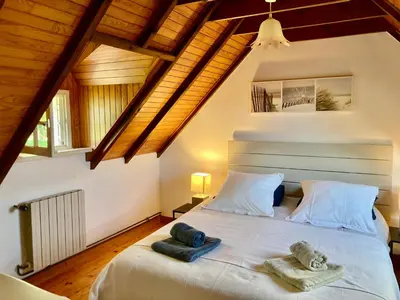 Un ou plusieurs lits dans un hébergement de l'établissement Benniel bihan maison de vacances à 5 minutes des plages de la baie de Douarnenez