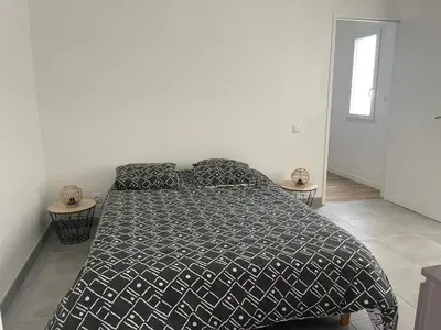 Un ou plusieurs lits dans un hébergement de l'établissement Maison familiale spacieuse à Plouguerneau avec jardin