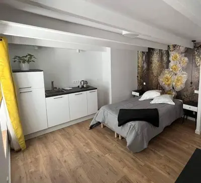 Un ou plusieurs lits dans un hébergement de l'établissement Agréable studio pour 2 personnes Studio Melen