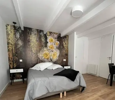 Un ou plusieurs lits dans un hébergement de l'établissement Agréable studio pour 2 personnes Studio Melen