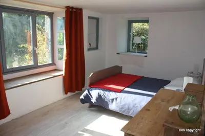 Un ou plusieurs lits dans un hébergement de l'établissement Gîte des Hortensias - Old farmhouse - Sea view
