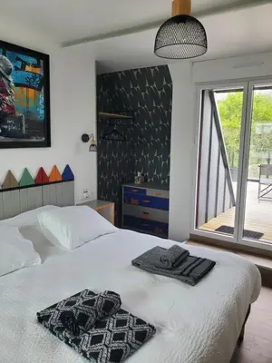 Un ou plusieurs lits dans un hébergement de l'établissement Chambre et table d'Hotes Manava Loretta