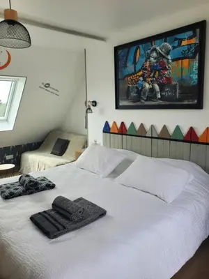 Un ou plusieurs lits dans un hébergement de l'établissement Chambre et table d'Hotes Manava Loretta