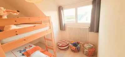 Un ou plusieurs lits dans un hébergement de l'établissement Face à l'océan accès direct à la plage, la maison des dunes