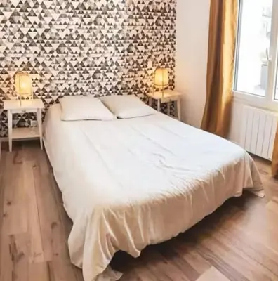 Un ou plusieurs lits dans un hébergement de l'établissement Appartement avec grande terrasse