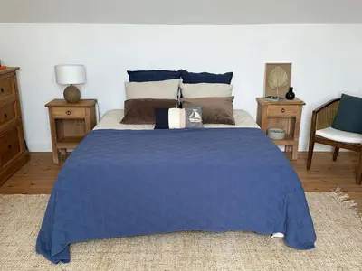 Un ou plusieurs lits dans un hébergement de l'établissement Maison de charme 3 chambres plage de Lodonnec