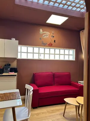 Coin salon dans l'établissement Charmant appartement Havana