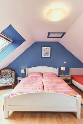 Un ou plusieurs lits dans un hébergement de l'établissement Cottage Batz - Moulin de Kerellec