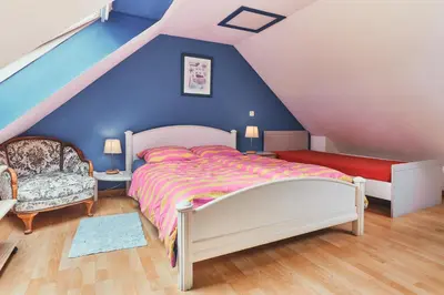Un ou plusieurs lits dans un hébergement de l'établissement Cottage Batz - Moulin de Kerellec
