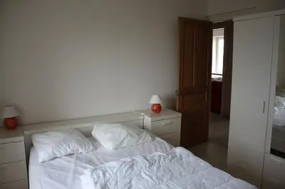 Un ou plusieurs lits dans un hébergement de l'établissement appartement 3 chambres, plage à 400 m