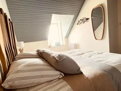Un ou plusieurs lits dans un hébergement de l'établissement Gîte Ty Mamm Gozh