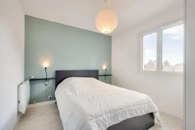 Un ou plusieurs lits dans un hébergement de l'établissement Maison pour 6 avec terrasse et jardin