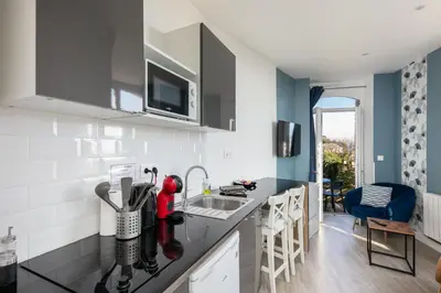 Cuisine ou kitchenette dans l'établissement Le Moulin Blan