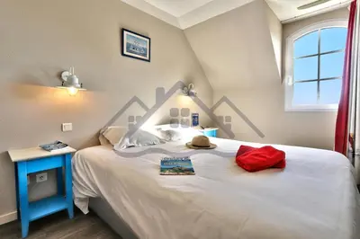 Un ou plusieurs lits dans un hébergement de l'établissement LocaLise - Maison D02 - Vue mer - Accès piscine - Wifi inclus - Draps et lits faits inclus - Face à la plage - Centre et port à 700m