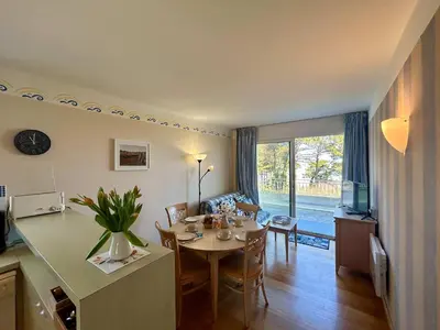 Coin salon dans l'établissement Seafront flat with indoor pool with stunning views