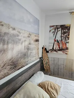 Un ou plusieurs lits dans un hébergement de l'établissement appartement terrasses poulpatre
