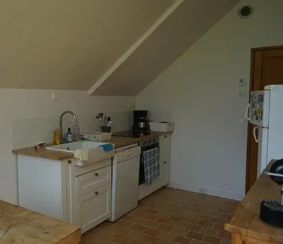 Cuisine ou kitchenette dans l'établissement Les communs du manoir