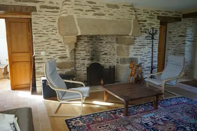 Coin salon dans l'établissement Les communs du manoir