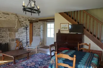 Coin salon dans l'établissement Les communs du manoir