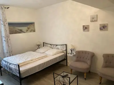 Un ou plusieurs lits dans un hébergement de l'établissement Un cocon en bord de mer