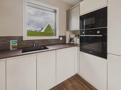 Cuisine ou kitchenette dans l'établissement Maison neuve avec terrasse et jardin pour 6
