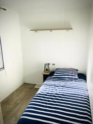 Un ou plusieurs lits dans un hébergement de l'établissement Mobil Home à 100m de la mer sur terrain privé