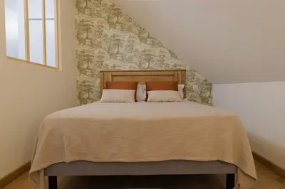 Un ou plusieurs lits dans un hébergement de l'établissement Chambres d'hôtes - Evasion Bretonne