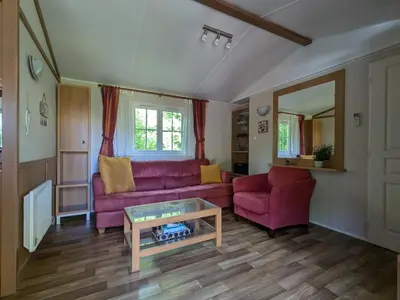 Coin salon dans l'établissement Mobile home tout confort dans un camping 4 étoiles