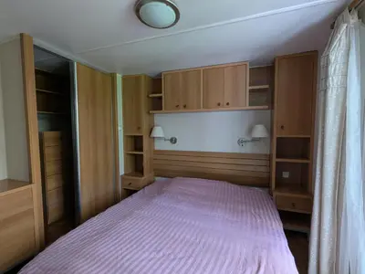 Un ou plusieurs lits dans un hébergement de l'établissement Mobile home tout confort dans un camping 4 étoiles