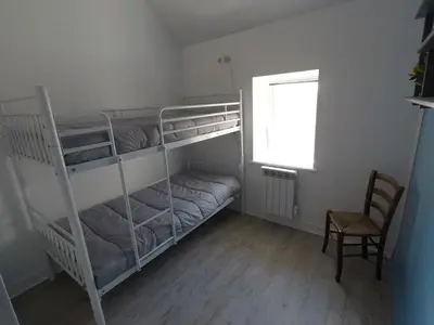 Un ou plusieurs lits dans un hébergement de l'établissement Petite maison de pêcheur en bord de mer