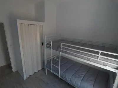 Un ou plusieurs lits dans un hébergement de l'établissement Petite maison de pêcheur en bord de mer