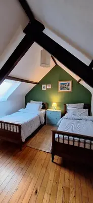 Un ou plusieurs lits dans un hébergement de l'établissement Stang Korvenn - Gîte du Vert Rivage