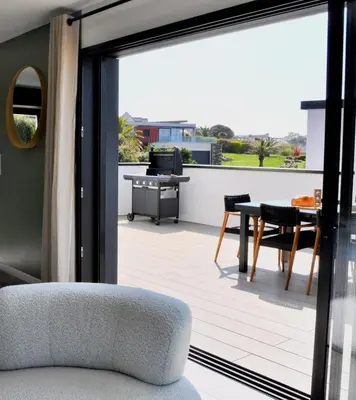 Coin salon dans l'établissement Villa Au Rythme Des Marées