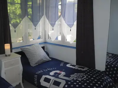 Un ou plusieurs lits dans un hébergement de l'établissement Appartement La Loob Gites de Daumesnil étage