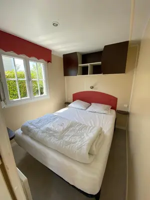 Un ou plusieurs lits dans un hébergement de l'établissement Camping Le Bois D'Amour