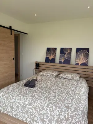 Un ou plusieurs lits dans un hébergement de l'établissement Maison neuve 4 chambres