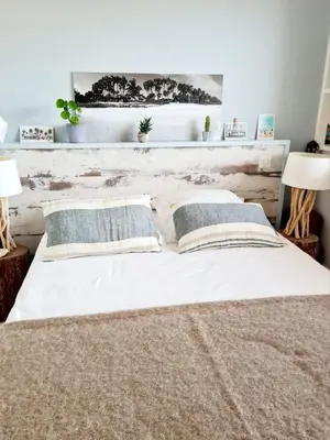 Un ou plusieurs lits dans un hébergement de l'établissement Splendide appartement face à la mer, parking, wifi