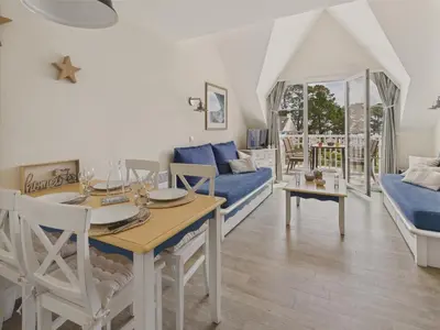 Coin salon dans l'établissement Balcon vue mer et piscine pour 4 personnes
