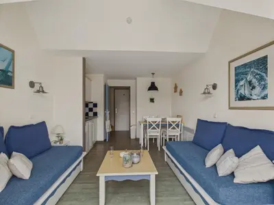 Coin salon dans l'établissement Balcon vue mer et piscine pour 4 personnes