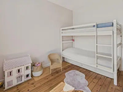 Un ou plusieurs lits dans un hébergement de l'établissement Maison avec jardin pour 4 adultes et 2 enfants